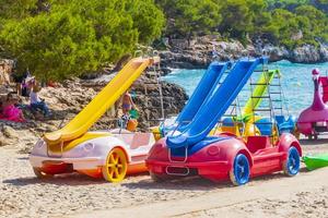 Mallorca Balearic Islands Spain 2018 Pedal boats with slides on the beach. Car slides Mallorca. photo