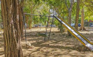 Slide and climbing frame on a playground park in Mexico. photo