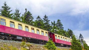 Brockenbahn Locomotive railway train at Brocken mountain peak Harz Germany. photo