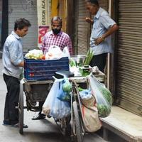 Old Delhi, India - April 15, 2022 - Portrait of shopkeepers or street vendors in Chandni Chowk market of Delhi, Old Delhi Street Photography photo