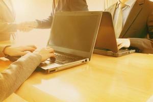 Business people shaking hands, finishing up meeting photo