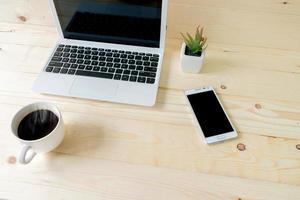 Laptop with tablet and smart phone on Workplace photo