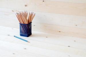 Wood pencils in metal pot photo