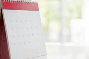 Calendar Standing On Brown Wood Surface photo
