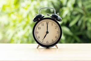 at 7 o'clock in the morning connect the time at for work with tree background photo