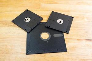 A floppy disk or diskette disk was a ubiquitous form of data storage and exchange from the mid-1970s into the mid-2000, concept old technology photo