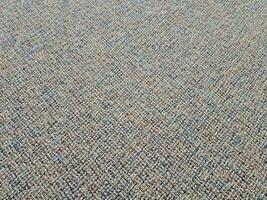 moqueta o alfombra gris y marrón en el suelo o en el suelo foto