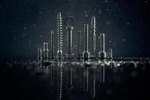 Abstract panorama of city with reflection, made by metal bolt and nut chrome. Black background with bokeh. photo