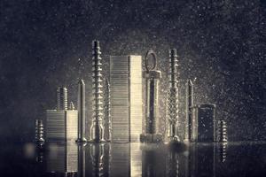 Abstract panorama of city illuminated by bright light with reflection, made by metal bolt, staples for paper stapler and nut chrome. Black background with bokeh. photo