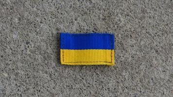 Ukraine flag on the ground photo