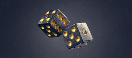 Two black dice are falling on a dark gray background. Photo with bokeh.