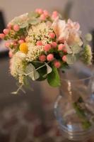 Delicate and elegant wedding bouquet in a vase. photo