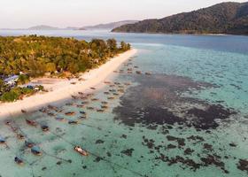 Aerial view of Tropical sea with white beach and coral reef photo