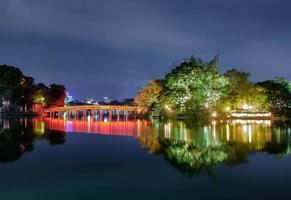 Landmark of red bridge Ho Hoan Kiem, lake of the returned sword at night photo