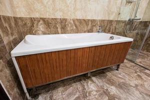 Bathtub white ceramic and wood texture interior luxury photo