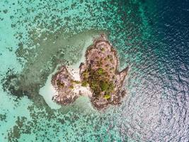 Aerial view of island in tropical sea photo