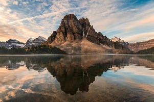 Rocky mountain reflection on Cerulean lake in Assiniboine provincial park photo