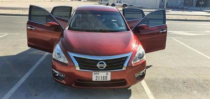 Dubai, UAE may 2022, Nissan altima s6 2019 fornt view photo and door open