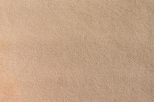 close-up Texture of light brown canvas fabric as background