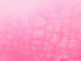 Cracked and Peeling Painted Pink Concrete Texture Background photo