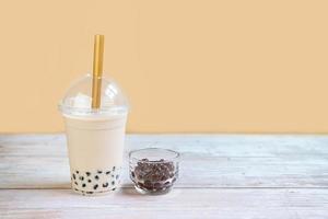 Bubble milk tea on wooden table with copy space photo