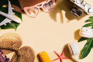 Travel summer accessories and items with shadow of tropical leaves on color background with copy space, Vacation planning concept photo