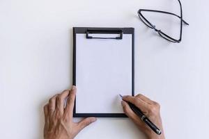 Empty file folder with hand writing on business desk office with copy space, Top view photo