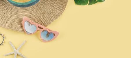 Women's accessories items on yellow background, Summer vacation web banner with copy space photo