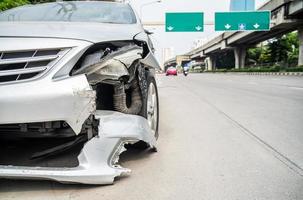 Front of car crash get damaged by accident on the road in the city, damaged automobiles photo