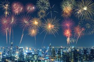 New Year multicolor fireworks celebration in Bangkok city skyline in night time photo