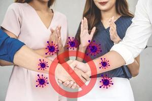 Stop shaking hands.Prevent virus from spreading with red forbidden sign, avoiding physical contact and corona virus infection, Prevent corona outbreak. photo