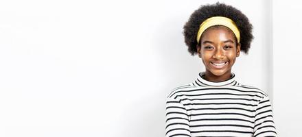 Cute african american girl with an afro hairstyle wearing casual clothes smiling, friendly welcome gesture photo