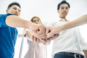 Teamwork business join hand together concept, Image of hands in circle as symbol of their partnership and teamwork,we will do the best concept, People joining for cooperation success business. photo