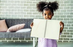 Cute black african american little girl showing self drawn painting,  African people - Children