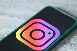 instagram application icon on Apple iPhone 13 Pro, smartphone with IG instagram logo on the screen popular social media network photo