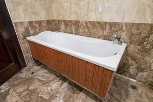 Bathtub white ceramic and wood texture interior luxury photo