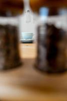 Cup of hot cappuccino coffee on table photo