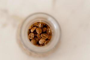 Cup of hot cappuccino coffee on table photo