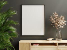 Mockup frame on wood cabinet in living room interior on empty dark wall background. photo