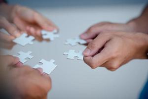Business people and puzzle teamwork concepts photo