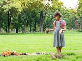 Young children play and learn outside of school to enjoy themselves in the nature park photo