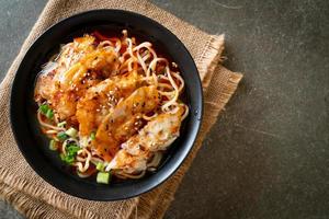 ramen noodles with gyoza or pork dumplings photo