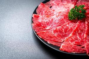 fresh beef raw sliced with marbled texture photo