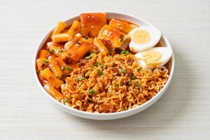 Korean instant noodles with Korean rice cake and fish cake and boiled egg photo