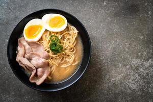 tonkotsu ramen noodles with pork and egg photo