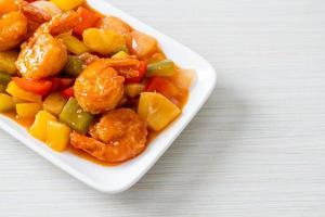 Stir-fried sweet and sour with fried shrimp photo