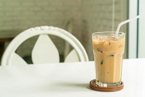 iced latte coffee glass on table photo
