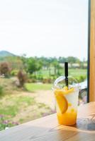 iced soda with yuzu orange in glass photo