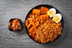 Korean instant noodles with Korean rice cake and fish cake and boiled egg photo