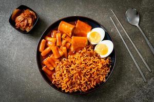 Korean instant noodles with Korean rice cake and fish cake and boiled egg photo